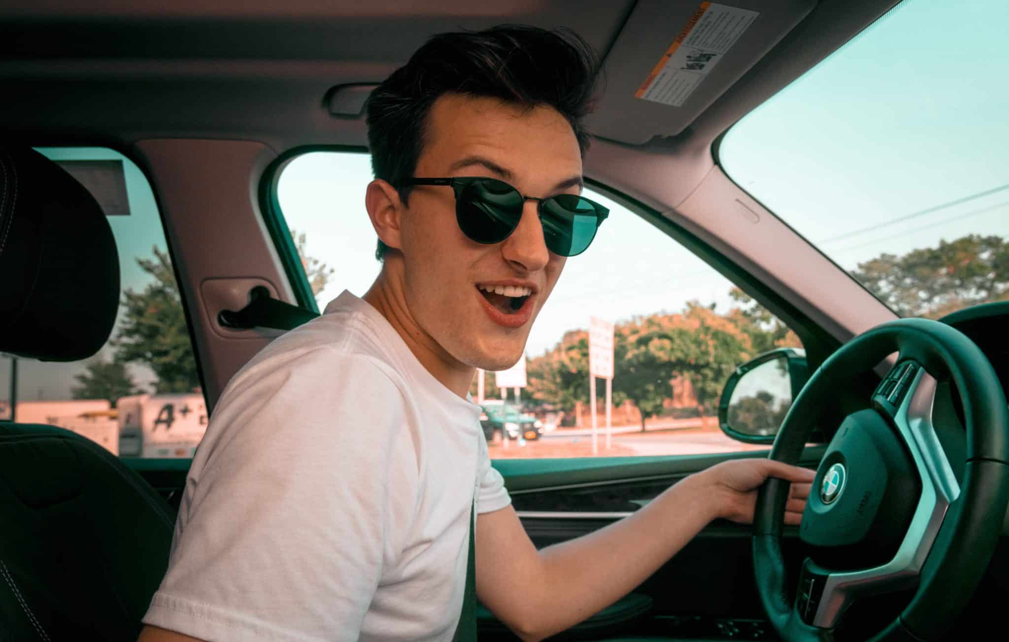 Teen boy behind the wheel of a BMW